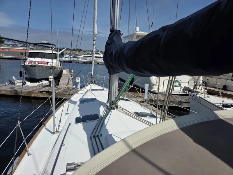 Slide: The Image of Beneteau Oceanis 411 sailboat docked at Signature, showcasing deck and rigging - 6257942