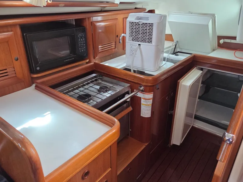 Slide: The Image of Full-featured galley with stove/oven, sink, fridge, freezer, and microwave - 6257933