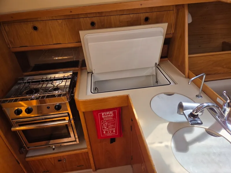 Slide: The Image of Galley with stove/oven, fridge, sink, and storage - 6257961