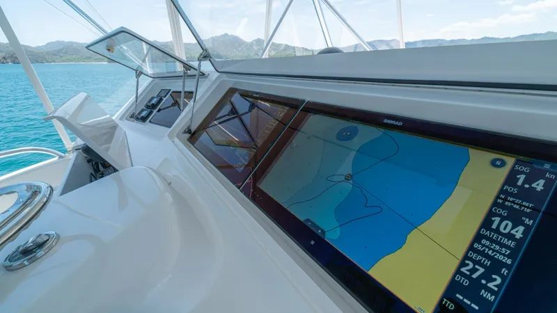 Slide: The Image of Flybridge Helm with Navigation Display The sleek flybridge helm of the 2005 Viking 61 Convertible, Honey Girl, features a state-of-the-art navigation display, ensuring precise chart plotting and route planning. The expansive screens and intuitive controls provide an unparalleled command experi - 6449570