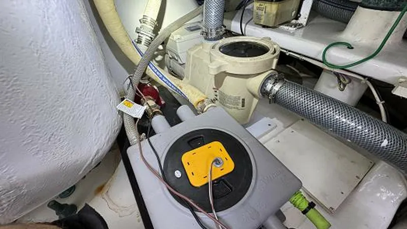 Slide: The Image of 2007 74 Viking 74 Enclosed Bridge Never Settle - Starboard Tuna Tube Pump and In Deck Live Well Drain Sump - 6312586