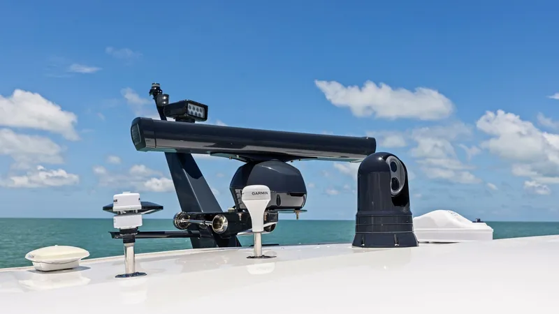 Slide: The Image of Flybridge Electronics and Radar Array The 2026 PRINCESS V55 features a sophisticated flybridge equipped with state-of-the-art electronics and radar systems. Prominently displayed are advanced navigation and communication devices, ensuring enhanced safety and connectivity while at sea. The sle - 6312364