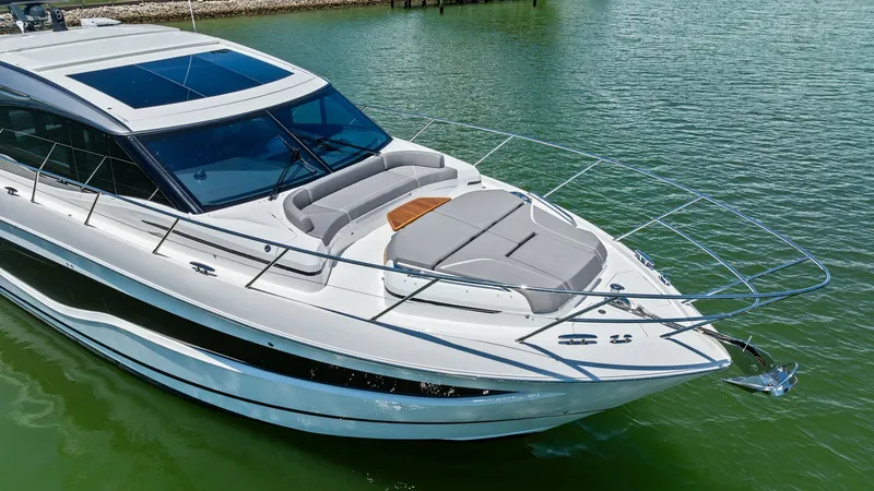Slide: The Image of Spacious Bow with Sunpad Lounge and Seating Area The 2026 PRINCESS V55 features an expansive bow area equipped with plush sunpads, perfect for relaxation and sunbathing. The sleek lines and modern design are complemented by stainless steel railings, ensuring safety and style. This space offers an inviti - 6312366