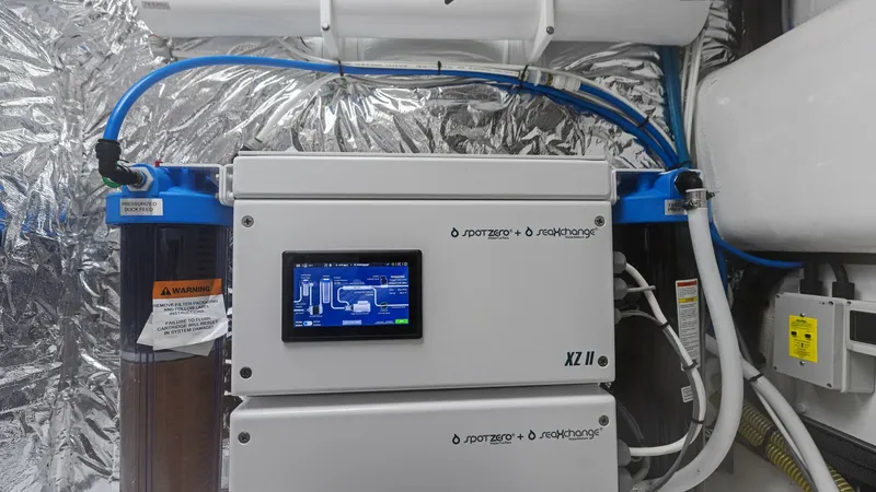 Slide: The Image of Spot Zero Advanced Water Filtration System This image showcases the state-of-the-art water filtration system aboard the 2026 PRINCESS V55. The system features a high-tech control panel for easy monitoring and operation, ensuring clean and safe water throughout your journey. The sleek and compact d - 6312377