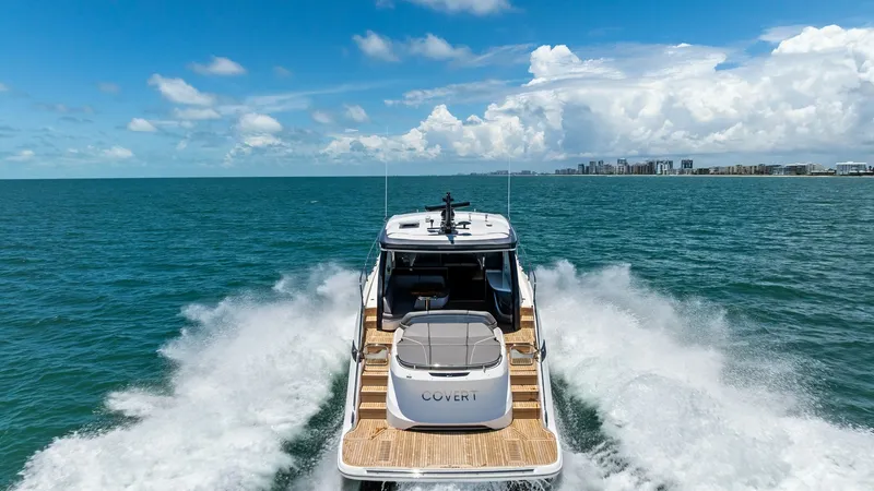 Slide: The Image of Cockpit Deck and Swim Platform View The 2026 PRINCESS V55 showcases a sleek cockpit deck with a spacious swim platform, perfect for leisure and easy access to the water. The elegant teak decking complements the modern design, while the open cockpit invites relaxation with comfortable seatin - 6312380