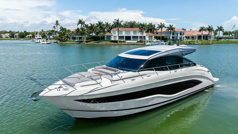 Slide: The Image of Elegant Exterior Profile The 2026 PRINCESS V55 showcases a sleek and modern exterior design, emphasizing its sophisticated lines and luxurious appeal. The expansive windows and stylish sunroof ensure ample natural light, enhancing the cruising experience. This vessel's streamline - 6312330