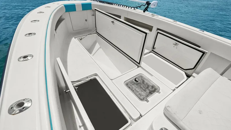 Slide: The Image of Spacious Bow Storage and Seating Area The bow of the 2015 SeaVee 320Z showcases ample storage with multiple compartments for easy access to gear and essentials. The seating area features cushioned backrests, providing comfort during long fishing trips or leisure cruises. Stainless steel fixtu - 6312131