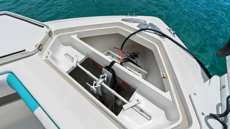 Slide: The Image of Anchor Locker with Integrated Storage This image showcases the anchor locker of the 2015 SeaVee 320Z, featuring a well-organized storage compartment. The locker is designed for easy access and secure stowage of the anchor, with ample space for additional lines and equipment. The robust constr - 6312133