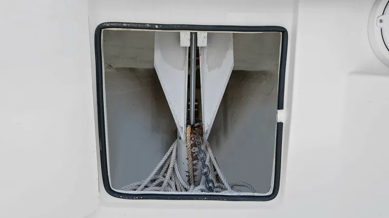 Slide: The Image of Anchor Locker with Rope Storage This image showcases the anchor locker of the 2015 SeaVee 320Z, featuring ample space for secure rope storage. The locker is designed for easy access and efficient organization, ensuring smooth anchoring operations. Its clean design and robust constructio - 6312134