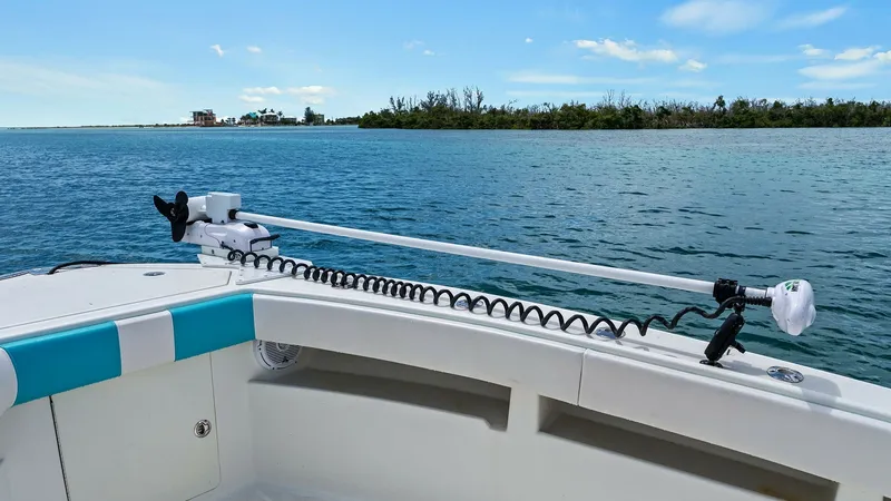 Slide: The Image of Bow with Trolling Motor The bow of the 2015 SeaVee 320Z features a sleek design equipped with a powerful trolling motor, ideal for precise maneuvering and fishing. The spacious deck offers ample room for casting, complemented by a clean, uncluttered surface. Enjoy panoramic view - 6312136