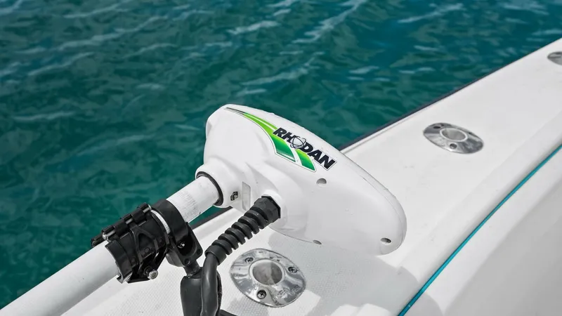 Slide: The Image of Bow Rail with Trolling Motor This image showcases the bow area of the 2015 SeaVee 320Z, featuring a robust Rhodan trolling motor. The sleek design integrates seamlessly into the deck, allowing for efficient maneuverability and fishing precision. Stainless steel fittings and the clean - 6312137