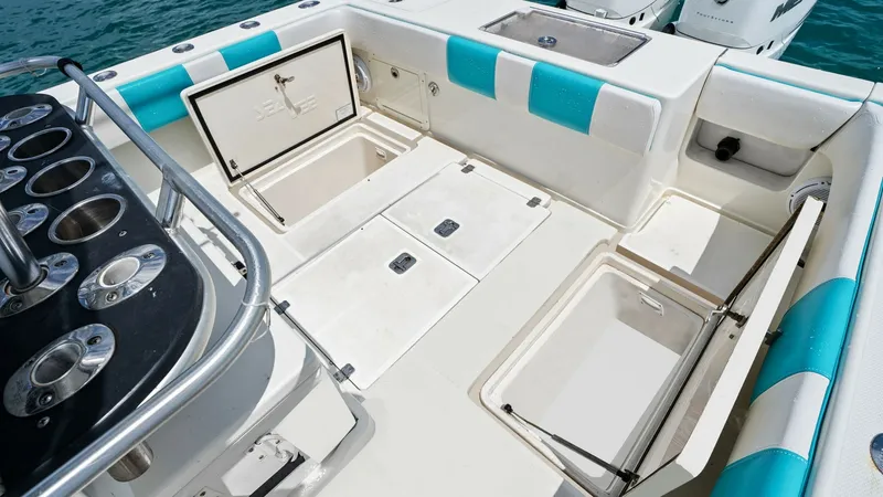 Slide: The Image of Spacious Aft Fishing Deck The aft fishing deck of the 2015 SeaVee 320Z showcases ample storage and functionality, perfect for avid anglers. Featuring multiple storage compartments and a well-organized tackle station, this area is designed for efficiency and convenience. The seatin - 6312139