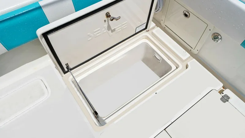 Slide: The Image of Aft Deck Storage Compartment The 2015 SeaVee 320Z features a spacious aft deck storage compartment, ideal for keeping your gear secure and organized. The compartment is designed with a sturdy, easy-to-lift hatch and durable finishes, ensuring long-lasting use. Its convenient placemen - 6312140