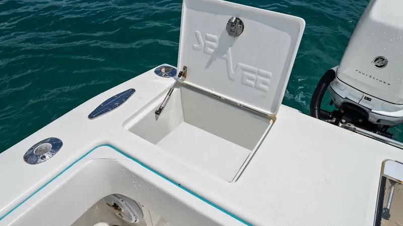 Slide: The Image of Aft Deck Baitwell with Open Lid This image showcases the aft deck of the 2015 SeaVee 320Z, featuring an open baitwell designed for easy access during fishing trips. The lid is embossed with the SeaVee logo, adding a touch of brand distinction. The layout highlights efficient use of spac - 6312142