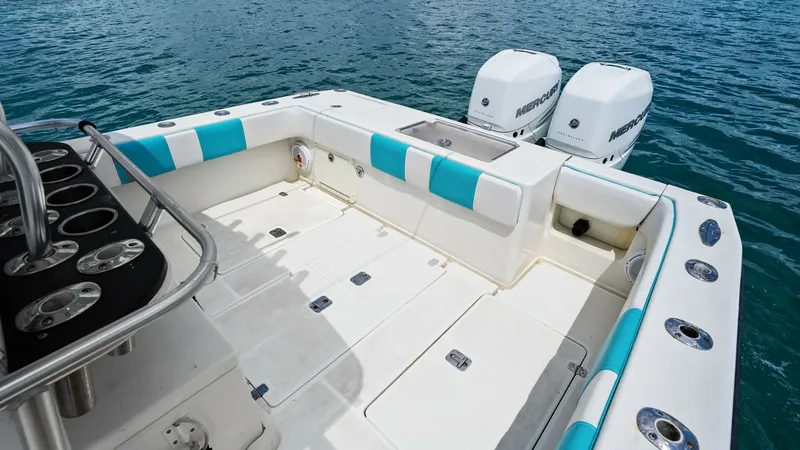 Slide: The Image of Spacious Aft Deck with Seating The aft deck of the 2015 SeaVee 320Z offers ample space for both relaxation and activity. Equipped with cushioned seating and a sleek, non-slip deck, this area ensures comfort and safety. The dual outboard engines highlight the vessel's power, making it i - 6312146