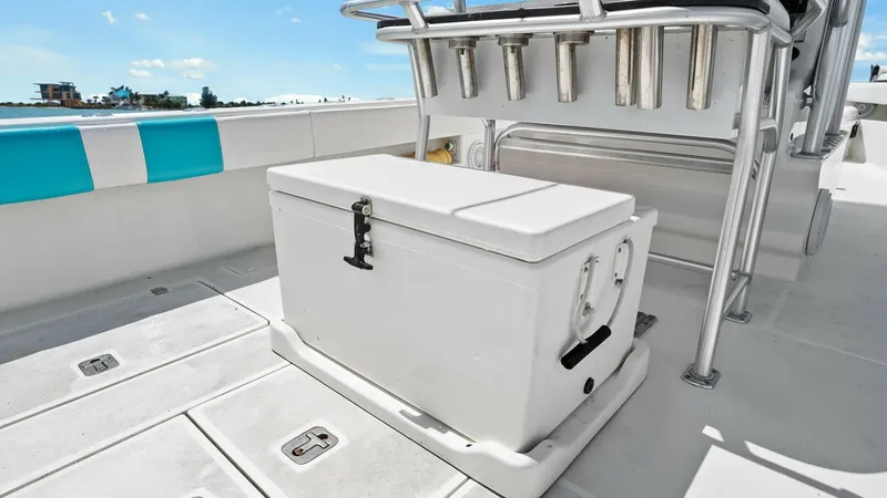 Slide: The Image of Cockpit Area with Cooler and Rod Holders The cockpit of the 2015 SeaVee 320Z 'Reel Tension' features a spacious deck area equipped with a sturdy cooler, perfect for storing your catch or refreshments. Integrated rod holders are conveniently positioned for easy access, making it ideal for avid an - 6312120