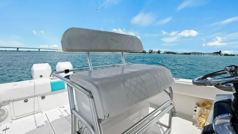 Slide: The Image of Helm Seating Area with Ocean View The helm seating area of the 2015 SeaVee 320Z offers a commanding view of the open water. Featuring a sleek design with durable, diamond-stitched upholstery, the seating is both comfortable and stylish. Stainless steel framework provides sturdy support, w - 6312125