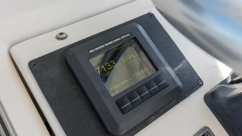 Slide: The Image of Helm Navigation Display Panel This image showcases the helm's navigation display panel on the 2006 Wellcraft 360 Coastal. The panel is elegantly integrated into the console, featuring a clear digital readout for precise navigation. Its sleek design ensures easy access and visibility, - 6312512