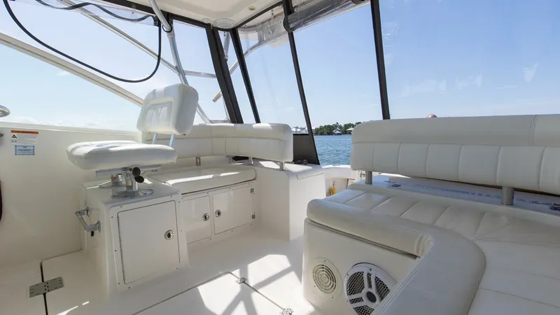 Slide: The Image of Spacious Cockpit with Seating Area The cockpit of the 2006 Wellcraft 360 Coastal offers a comfortable and airy seating area, perfect for socializing or relaxing while enjoying the view. The well-cushioned seats are upholstered in a durable, light-colored material, providing both comfort an - 6312513