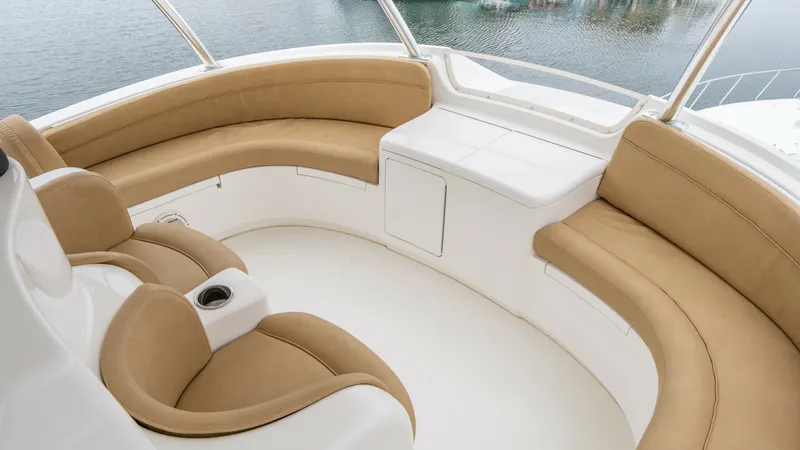 Slide: The Image of Skybridge Seating Area The skybridge of the 2020 Viking 92 offers a spacious seating area with wraparound cushioned benches and ergonomic helm chairs. The neutral tones and clean lines create an inviting space for relaxing and enjoying panoramic views. This area is perfect for - 6612574