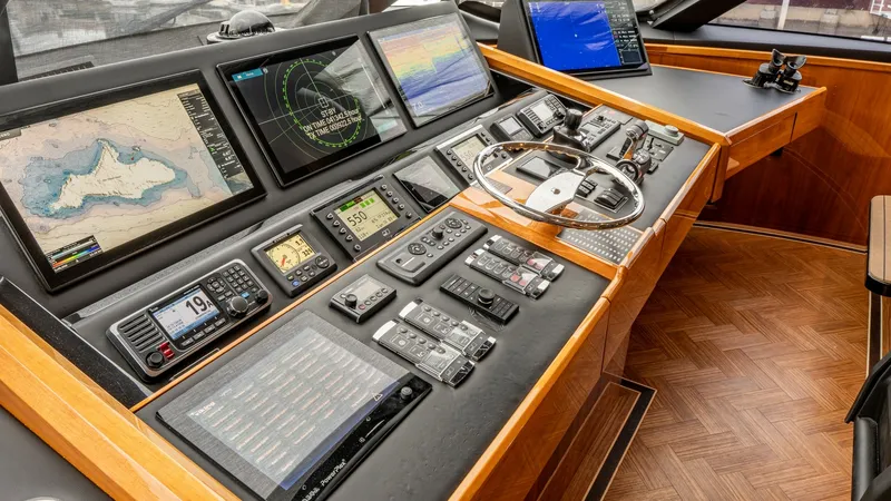 Slide: The Image of State-of-the-Art Helm Station The helm station of the 2020 Viking 92 Skybridge, 'AFTER MIDNIGHT,' showcases advanced navigation technology with multiple multi-function displays and precision instruments. The sleek design features a luxurious wood finish and ergonomic layout, ensuring - 6612554