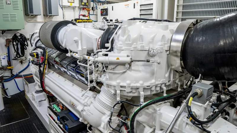 Slide: The Image of Advanced Engine Room The engine room of the Viking 92 Skybridge showcases a state-of-the-art power system with meticulously organized components. The prominent engine features advanced engineering and precision craftsmanship, ensuring optimal performance and reliability. Clea - 6612558