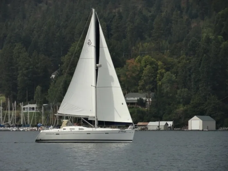 The Image of Sailing yacht Beneteau 393, 2007 model, gliding on a serene lake with forested backdrop - 6290625