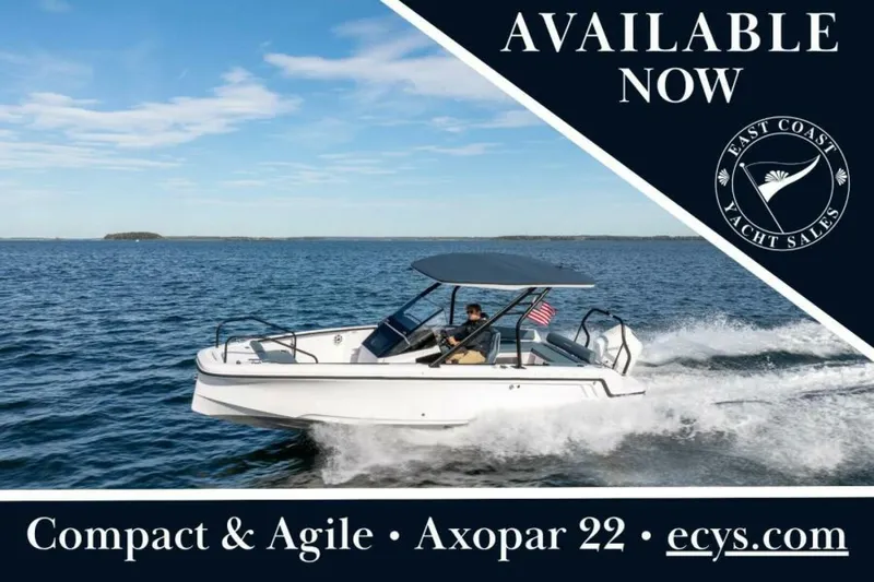 The Image of Axopar 22 T-Top Cruising in Casco Bay An Axopar 22 T-Top glides across Casco Bay under clear Maine skies, showcasing its sleek Nordic design and spirited performance. Featuring bold graphics announcing its availability, this striking dayboat is captured by East Coast Yacht Sales. - 7383402