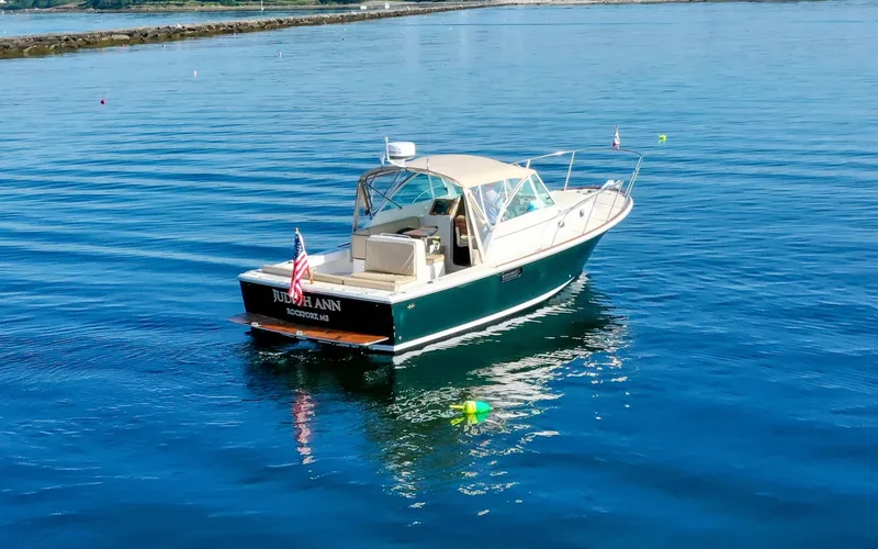 Slide: The Image of Hunt Surfhunter 29 - Judith Ann 2005 Hunt Yachts Surfhunter 29 cruising on calm blue waters. - 6302464