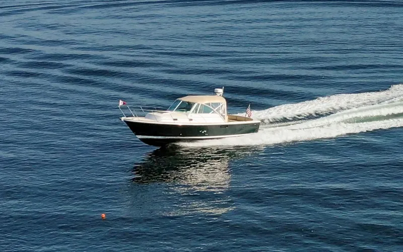 Slide: The Image of Hunt Surfhunter 29 - Judith Ann 2005 Hunt Yachts Surfhunter 29 cruising on calm blue waters. - 6302489