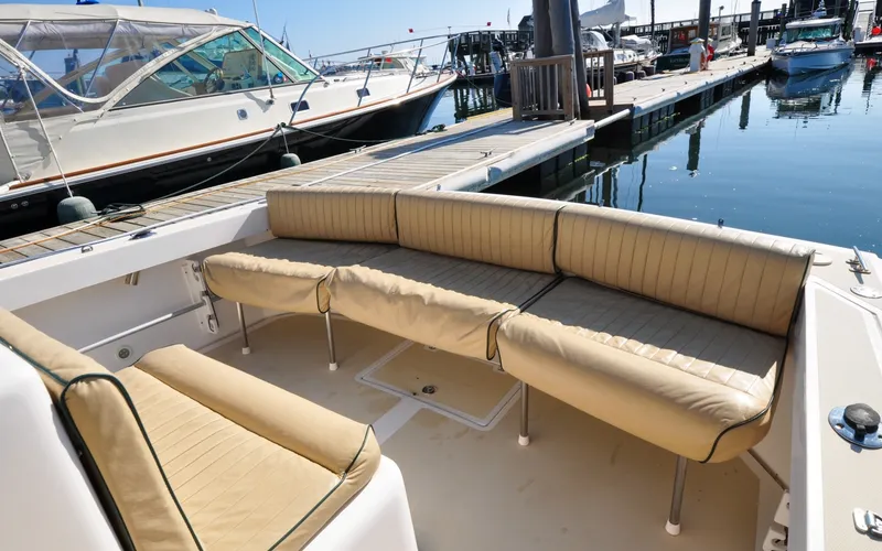 Slide: The Image of Hunt Surfhunter 29 - Judith Ann 2005 Hunt Yachts Surfhunter 29 with beige seating at a marina dock. - 6302502