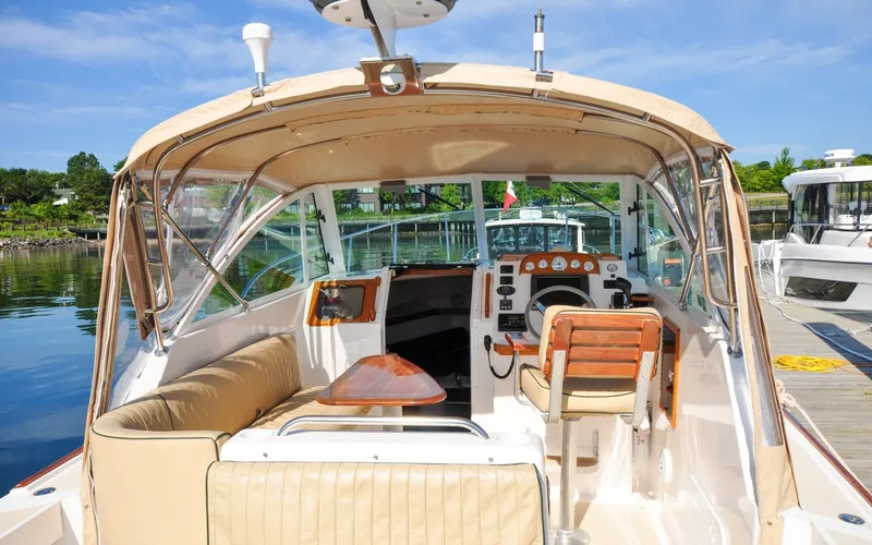 Slide: The Image of Hunt Surfhunter 29 - Judith Ann 2005 Hunt Yachts Surfhunter 29 interior with helm, seating, and dock view. - 6302480