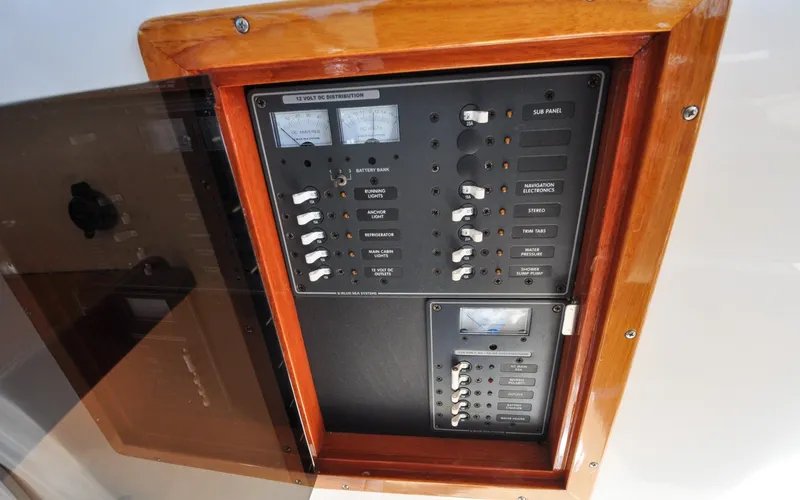 Slide: The Image of Hunt Surfhunter 29 - Judith Ann Electrical panel of 2005 Hunt Yachts Surfhunter 29, featuring switches and gauges. - 6302532