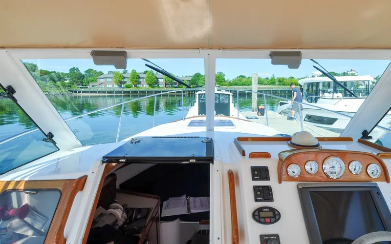 Slide: The Image of Hunt Surfhunter 29 - Judith Ann 2005 Hunt Yachts Surfhunter 29 cockpit view, docked with scenic waterfront background. - 6302511