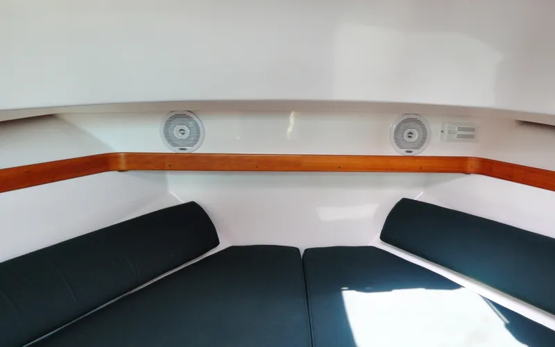 Slide: The Image of Hunt Surfhunter 29 - Judith Ann 2005 Hunt Yachts Surfhunter 29 cabin interior with cushioned seating and wooden trim. - 6302525