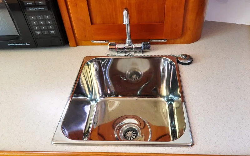 Slide: The Image of Hunt Surfhunter 29 - Judith Ann Stainless steel sink in 2005 Hunt Yachts Surfhunter 29 galley kitchen. - 6302527