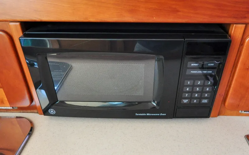 Slide: The Image of Hunt Surfhunter 29 - Judith Ann GE microwave oven in 2005 Hunt Yachts Surfhunter 29 kitchen area. - 6302528