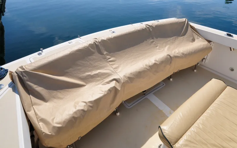 Slide: The Image of Hunt Surfhunter 29 - Judith Ann 2005 Hunt Yachts Surfhunter 29 boat seating with protective cover on calm water. - 6302533