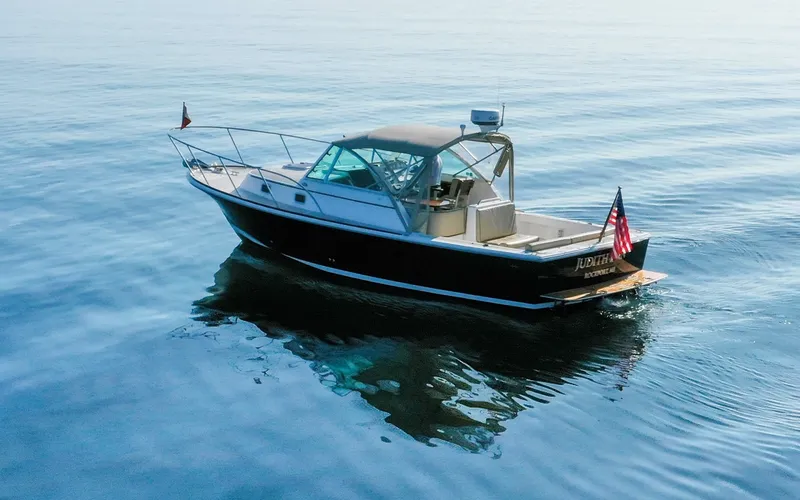 Slide: The Image of Hunt Surfhunter 29 - Judith Ann 2005 Hunt Yachts Surfhunter 29 cruising on calm blue waters. - 6302472