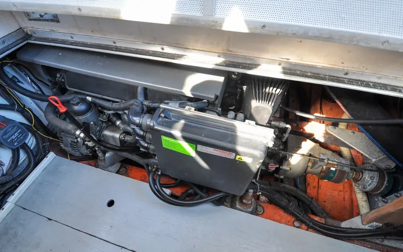 Slide: The Image of 1958 Bunker and Ellis 42 | Aleria Engine compartment of a 1958 Bunker and Ellis 42 boat, showcasing mechanical components. - 6307554