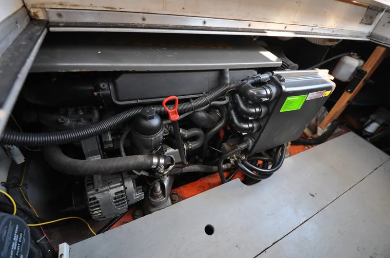 Slide: The Image of 1958 Bunker and Ellis 42 | Aleria Engine compartment of a 1958 Bunker and Ellis 42 boat, showcasing mechanical components. - 6307558