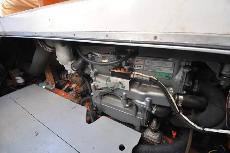 Slide: The Image of 1958 Bunker and Ellis 42 | Aleria Engine compartment of a 1958 Bunker and Ellis 42 boat, showcasing mechanical components. - 6307560