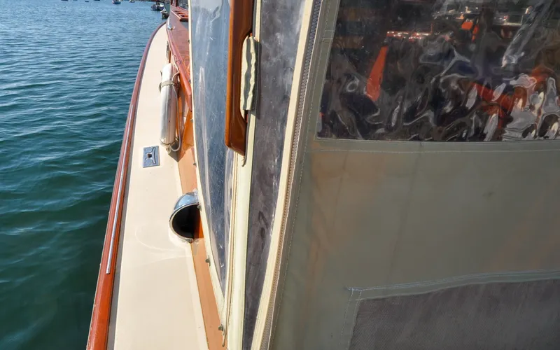 Slide: The Image of 1958 Bunker and Ellis 42 | Aleria Side view of a 1958 Bunker and Ellis 42 boat on water. - 6307467