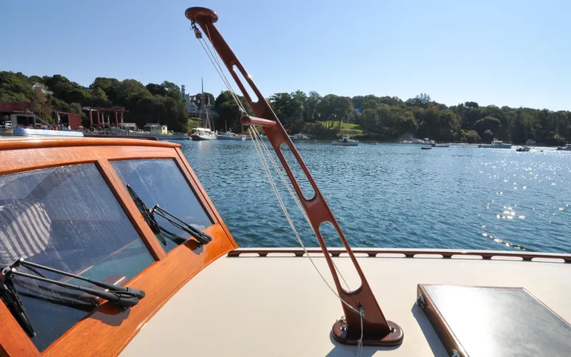 Slide: The Image of 1958 Bunker and Ellis 42 | Aleria 1958 Bunker and Ellis 42 boat on serene water with scenic shoreline view. - 6307470