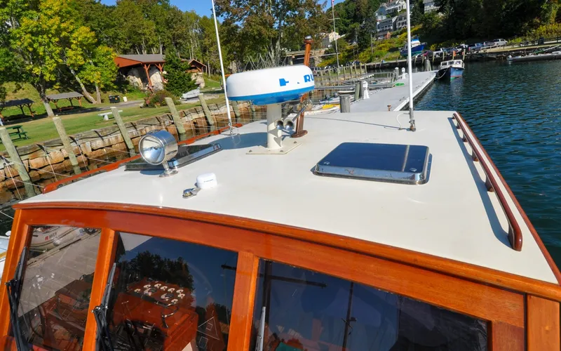Slide: The Image of 1958 Bunker and Ellis 42 | Aleria 1958 Bunker and Ellis 42 boat docked by a scenic waterfront. - 6307413
