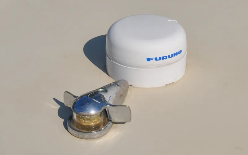 Slide: The Image of 1958 Bunker and Ellis 42 | Aleria White Furuno antenna and chrome boat light on Bunker and Ellis 42, 1958 model. - 6307477