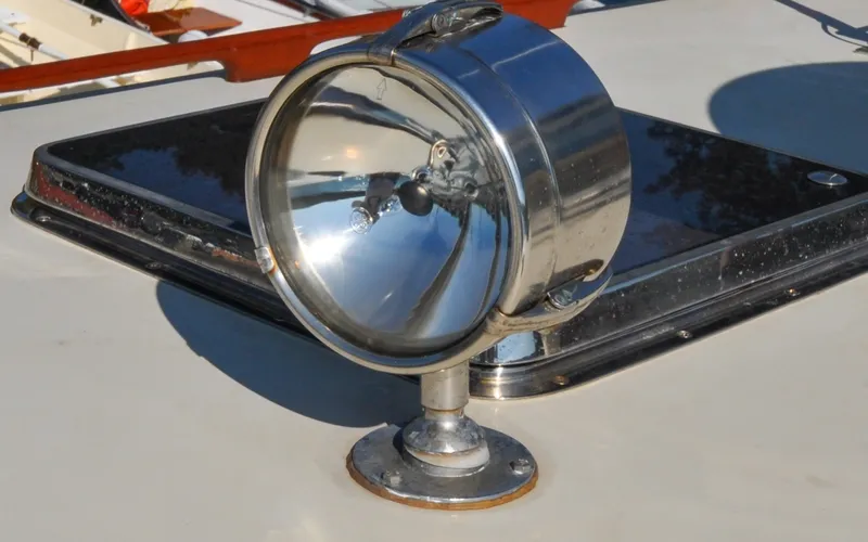 Slide: The Image of 1958 Bunker and Ellis 42 | Aleria 1958 Bunker and Ellis 42 spotlight on boat deck, chrome finish reflecting sunlight. - 6307480