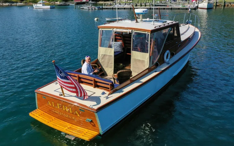 Slide: The Image of 1958 Bunker and Ellis 42 | Aleria Vintage 1958 Bunker and Ellis 42 boat named Aleria on calm water. - 6307425