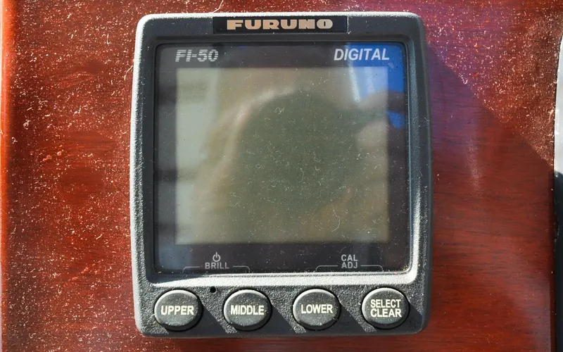Slide: The Image of 1958 Bunker and Ellis 42 | Aleria Furuno FI-50 digital display on a 1958 Bunker and Ellis 42 boat dashboard. - 6307417