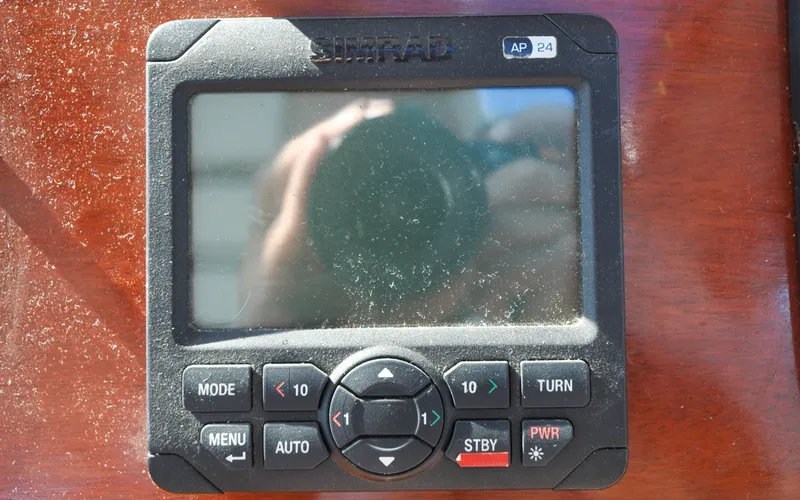 Slide: The Image of 1958 Bunker and Ellis 42 | Aleria Simrad AP24 autopilot control on a 1958 Bunker and Ellis 42 boat. - 6307418